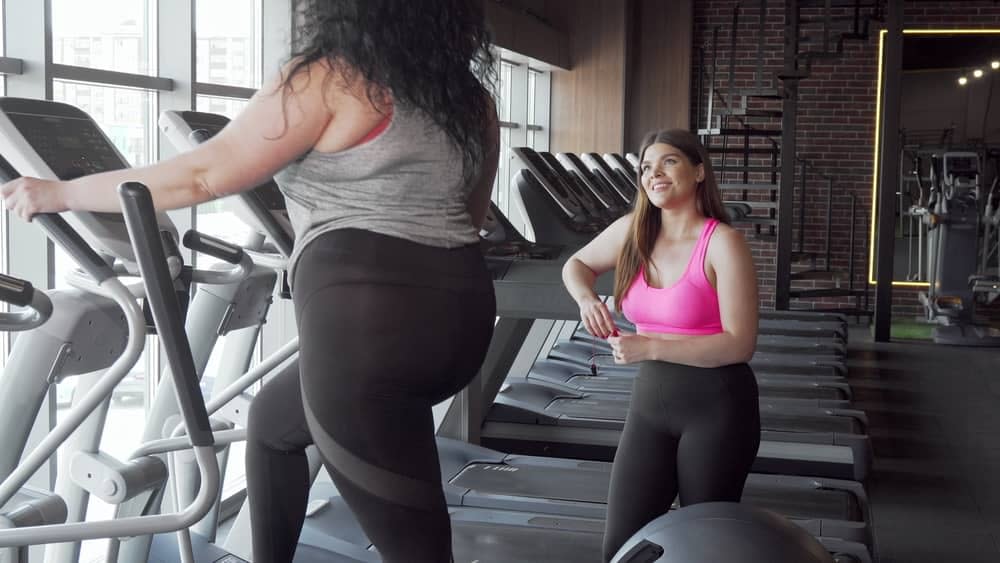 A pair of girl working out in the gym