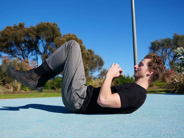 Man doing core workout outdoor