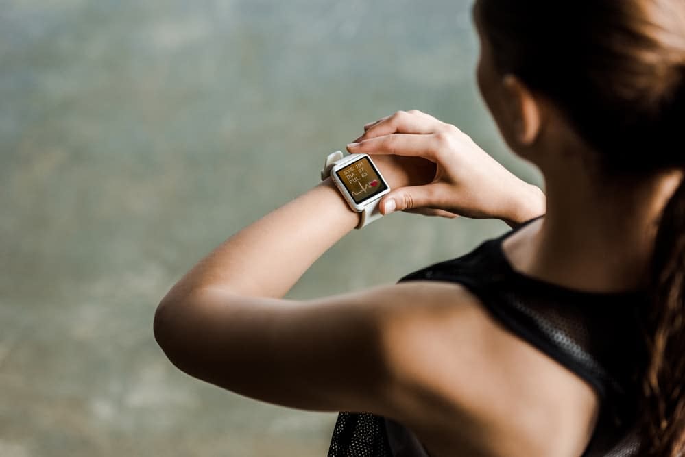 Woman checking heart rate on her smart watch