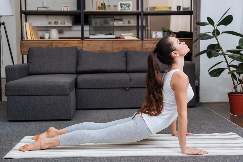 Woman Doing the Cobra Pose at Home